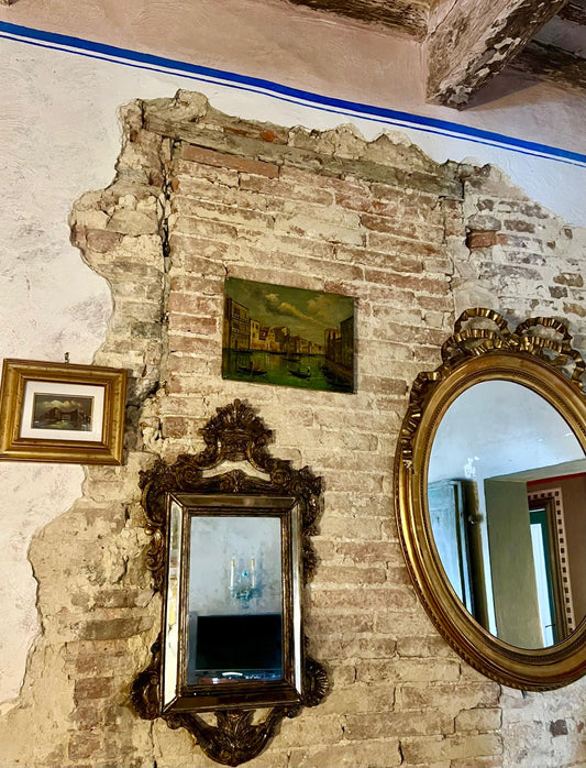 Antique Baroque-style mirror with ornate gilded frame