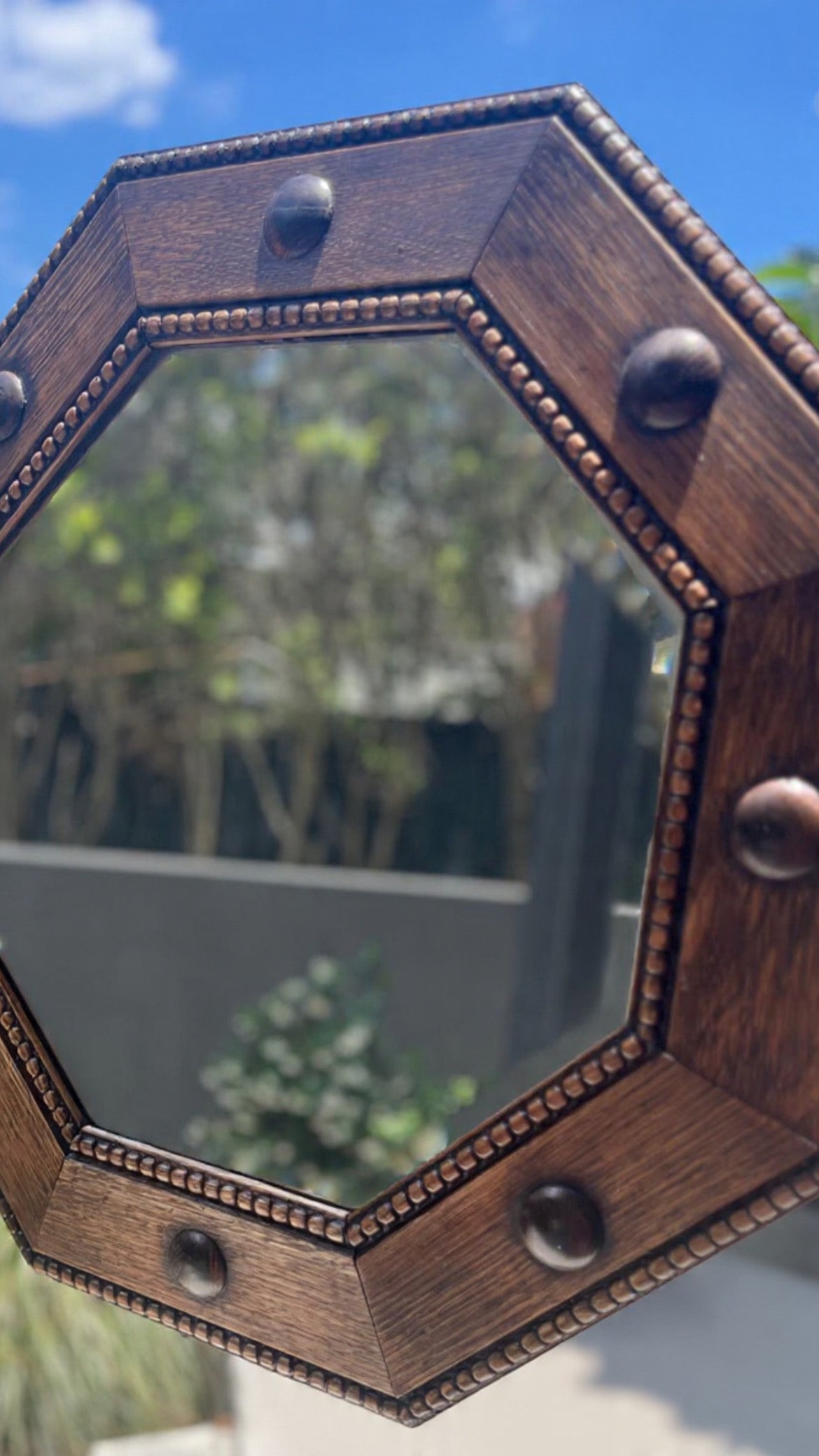 Regency-style octagonal shaped oak wall mirror with carved beaded trim