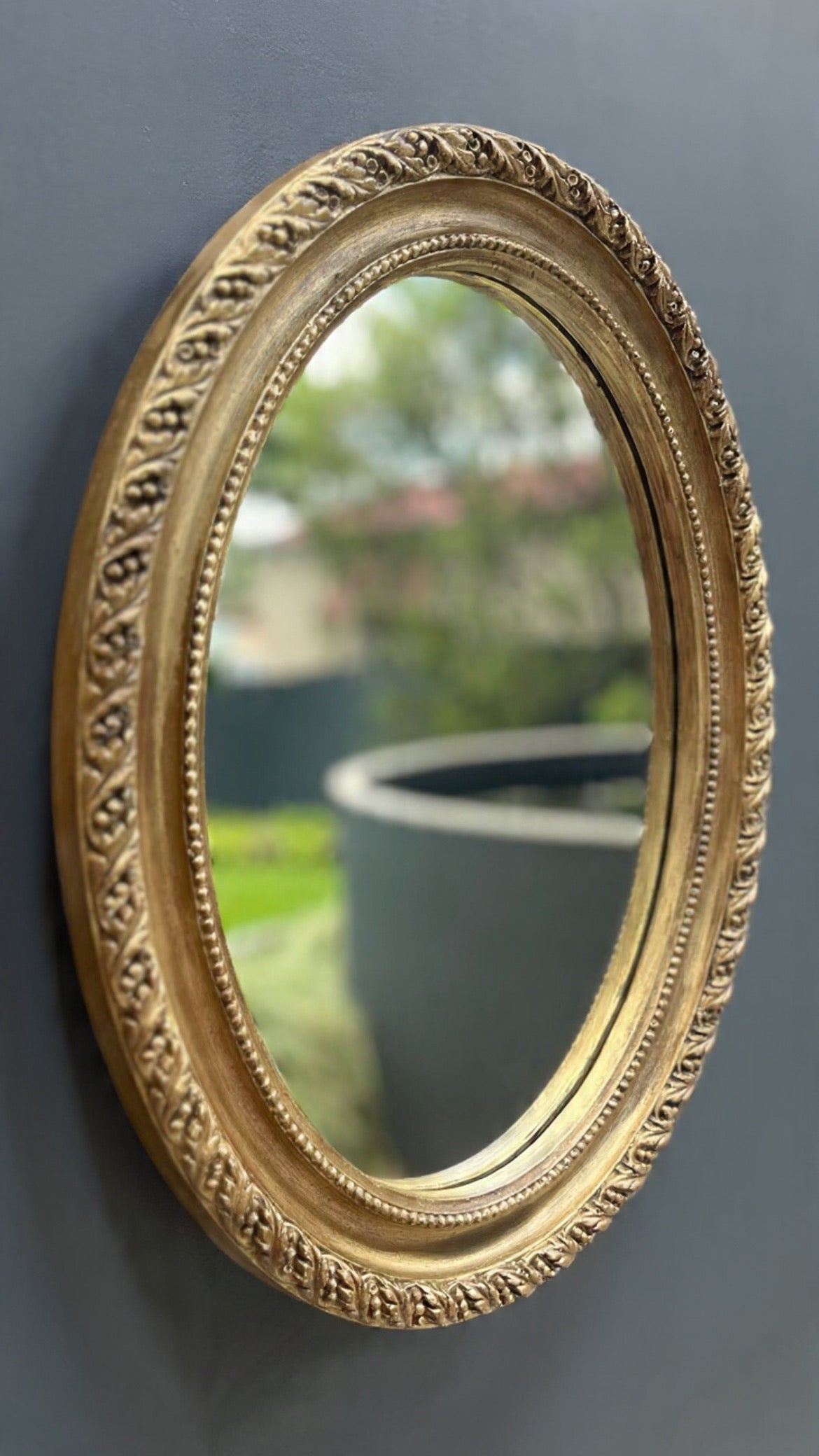 Vintage ornate gilt framed oval mirror