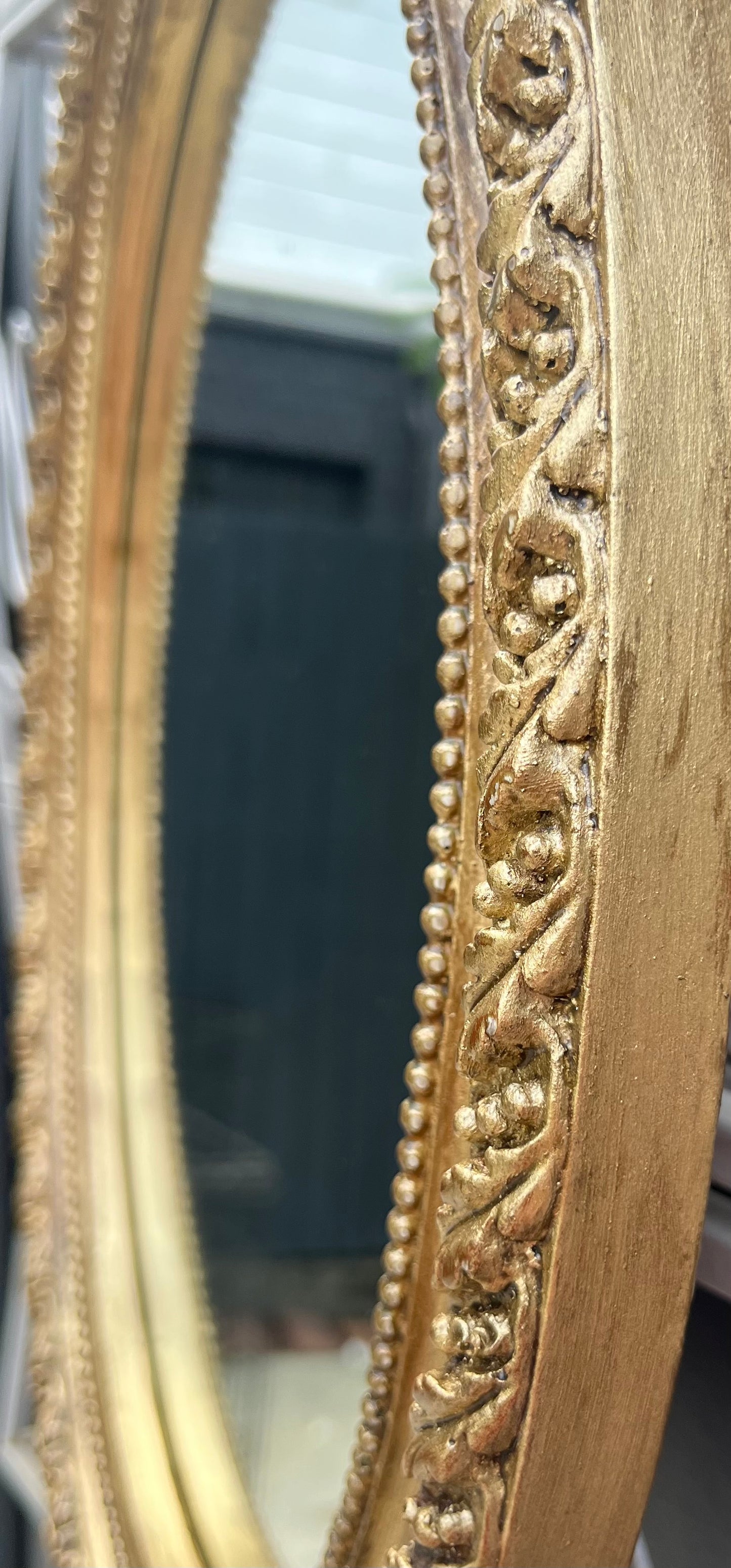 Vintage ornate gilt framed oval mirror