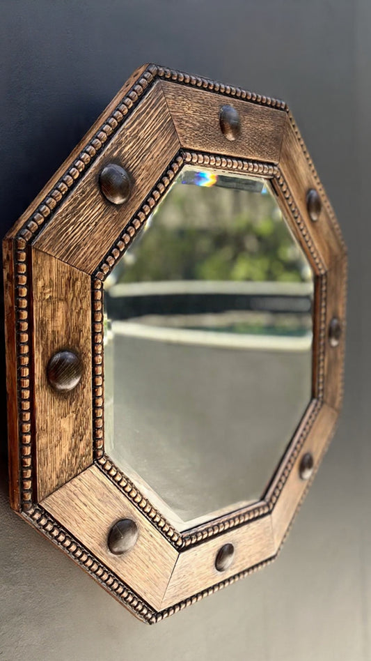 Regency-style octagonal shaped oak wall mirror with carved beaded trim