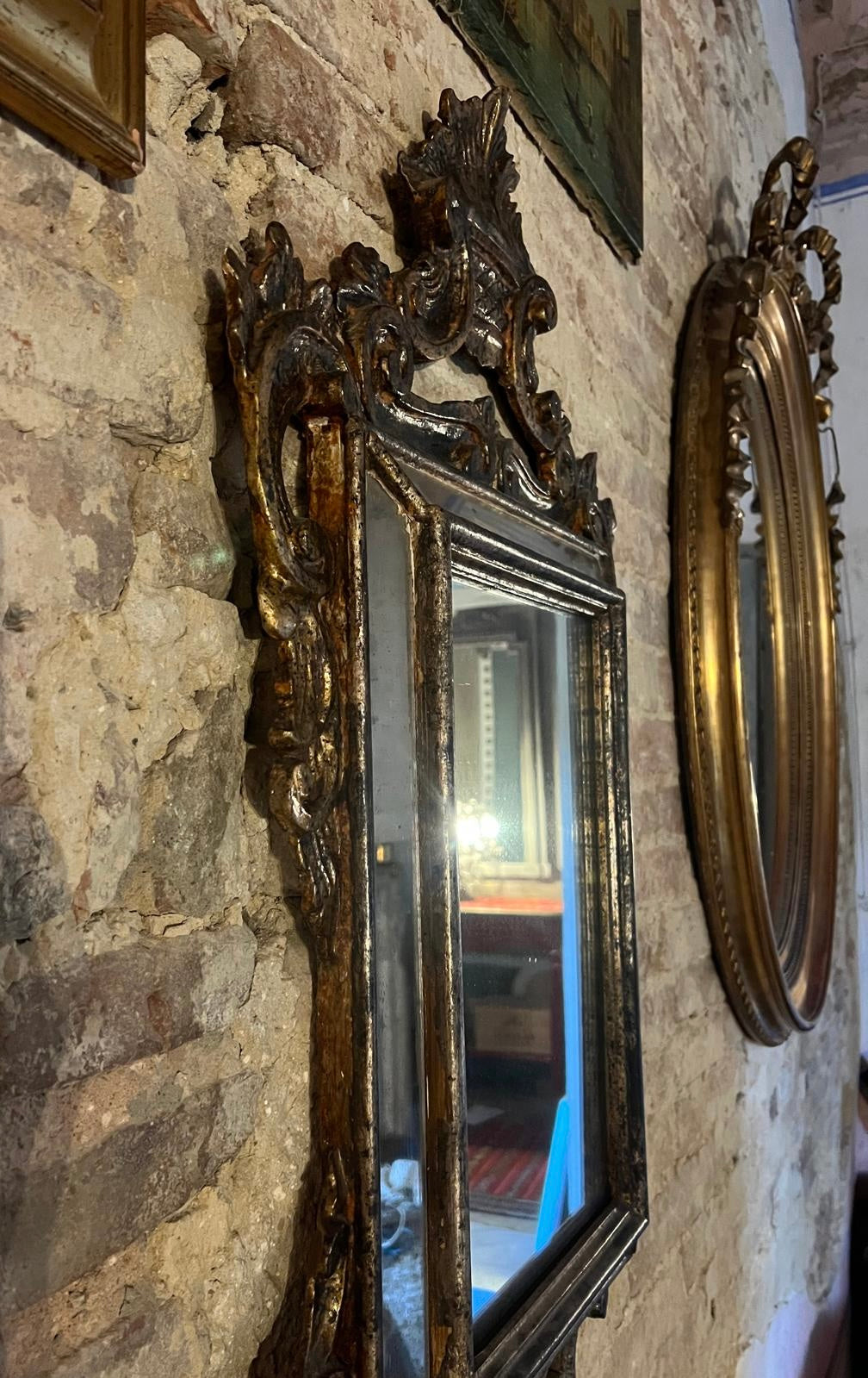 Antique Baroque-style mirror with ornate gilded frame