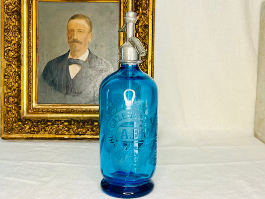 Blue French glass soda siphon bottle with a silver lid | roam. Global Treasures